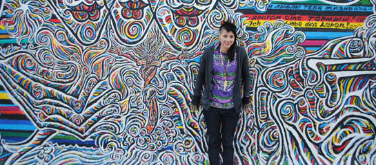 Skye Mayring in front of the Berlin Wall East Side Gallery // © 2011 Skye Mayring F